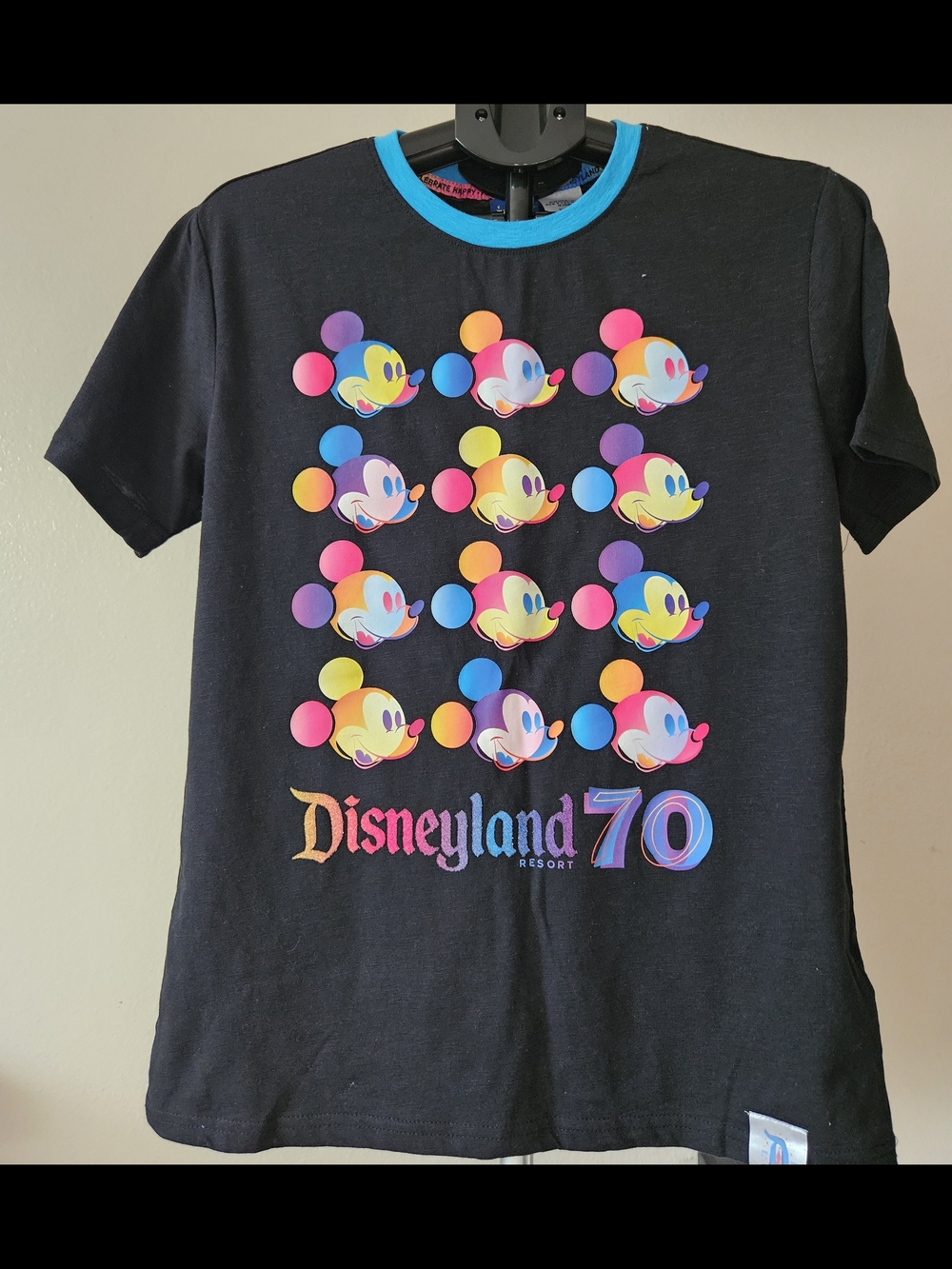 Disneyland Resort 70th Anniversary T-shirt features a colorful grid of Mickey